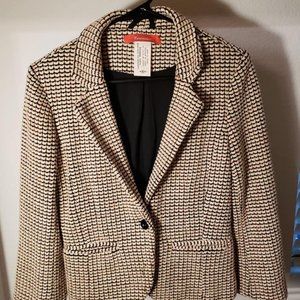 Cartonnier beige, orange, and black jacket